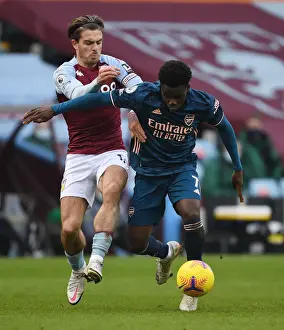 Bukayo Saka vs Jack Grealish: A Battle at Villa Park in Empty Premier League Stadiums (Aston Villa v Arsenal, 2021)