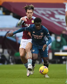 Aston Villa V Arsenal 2020-21 Prints: Bukayo Saka vs Jack Grealish: A Riveting Rivalry in Empty Premier League Stands (Aston Villa vs Arsenal)