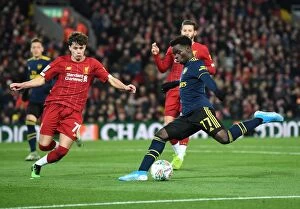 Images Dated 31st October 2019: Bukayo Saka vs. Neco Williams: Intense Battle at Anfield - Carabao Cup 2019-20: Liverpool vs