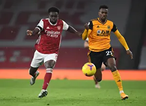 Bukayo Saka vs. Nelson Semedo: A Battle at Empty Emirates - Arsenal vs. Wolverhampton Wanderers (Premier League 2020-21)