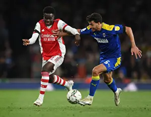 Arsenal V AFC Wimbledon 2021-22 Prints: Bukayo Saka vs. Will Nightingale: A Carabao Cup Battle at Emirates Stadium