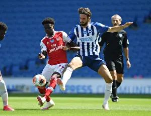 Brighton And Hove Albion V Arsenal 2019-20 Prints: Bukayo Saka vs. Propper: Empty Stadium Showdown - Brighton vs. Arsenal Amidst the Pandemic