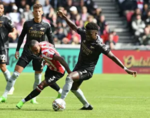 Bukayo Saka vs Rico Henry: Intense Battle at Brentford Community Stadium - Arsenal vs Brentford, Premier League 2022-23