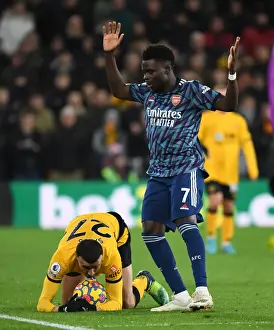 Bukayo Saka vs. Romain Saiss: Intense Battle in Wolverhampton Wanderers vs. Arsenal Premier League Clash