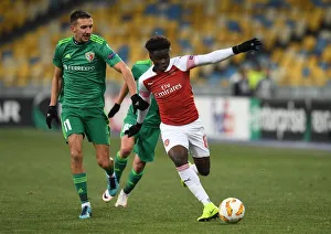 FC Vorskla Poltava V Arsenal 2018-19 Prints: Bukayo Saka vs. Vyacheslav Sharpar: Arsenal's Rising Star Faces Off Against Vorskla Defender in Europa League Clash