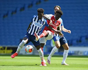 Brighton And Hove Albion V Arsenal 2019-20 Prints: Bukayo Saka vs. Yves Bissouma: A Battle in the Empty Arsenal Stadium
