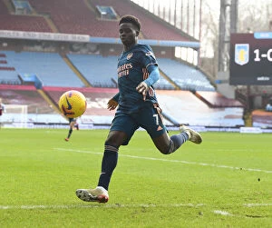 Images Dated 6th February 2021: Bukayo Saka's Brilliant Performance at Empty Villa Park: Arsenal's Premier League Victory Amidst