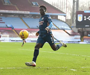 Bukayo Saka's Brilliant Performance at Empty Villa Park: Arsenal's Premier League Victory Amidst COVID-19 Restrictions