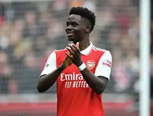 Arsenal V Crystal Palace 2022-23 Prints: Bukayo Saka's Epic Victory Celebration: Arsenal's Star Wins Over Crystal Palace Fans at Emirates Stadium