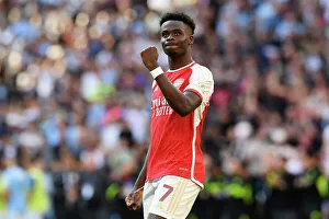 Bukayo Saka's Triumphant Celebration: Arsenal Claim Community Shield Victory over Manchester City