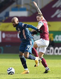 Images Dated 6th March 2021: Burnley vs Arsenal: Lacazette Faces Brownhill in Empty Turf Moor, Premier League 2021