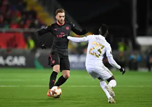 Ostersunds V Arsenal 2017-18 Prints: Calum Chambers Outmaneuvers Samuel Mensah in Arsenal's Europa League Clash vs Ostersunds