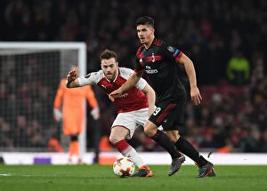 Images Dated 15th March 2018: Calum Chambers vs. Andre Silva: Intense Battle in Arsenal's Europa League Clash against AC Milan
