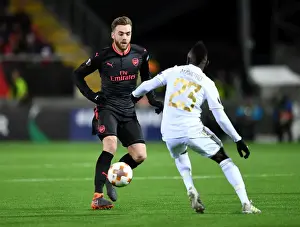 Ostersunds V Arsenal 2017-18 Prints: Calum Chambers vs. Samuel Mensah: Clash in the Europa League between Ostersunds and Arsenal