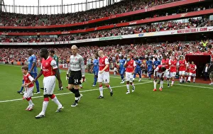 Captain Kolo Toure leads out the Arsenal team