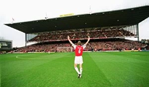 Highbury Stadium Collection: Captain Tony Adams salutes the North Bank before his 500th league match for Arsenal