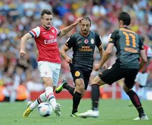 Arsenal V Galatasaray 2013-14 Prints: Carl Jenkinson (Arsenal) Nordin Amrabat and Albert Riera (Galatasaray)