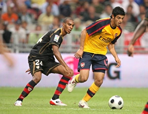 Images Dated 9th August 2008: Carlos Vela (Arsenal) Abdoulay Konko (Seville)