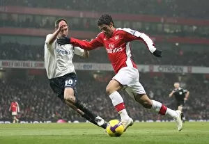 Images Dated 10th January 2009: Carlos Vela (Arsenal) Chris Basham (Bolton)