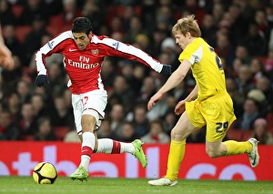 Images Dated 16th February 2009: Carlos Vela (Arsenal) Chris Burke (Cardiff)