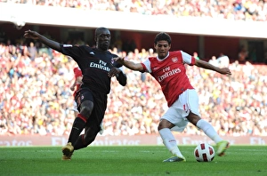 Arsenal v AC Milan 2010-11 Collection: Carlos Vela (Arsenal) Clarence Seedorf (Milan). Arsenal 1: 1 AC Milan. Emirates Cup