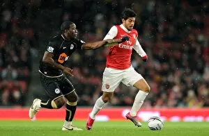 Arsenal v Wigan Athletic - Carlin Cup 2010-11 Collection: Carlos Vela (Arsenal) Hendry Thomas (Wigan). Arsenal 2: 0 Wigan Athletic