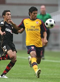 Images Dated 9th August 2008: Carlos Vela (Arsenal) Jesus Gonzalez (Seville)