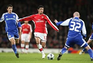 Images Dated 25th November 2008: Carlos Vela (Arsenal) Malkhaz Asatini (Dynamo Kyiv)