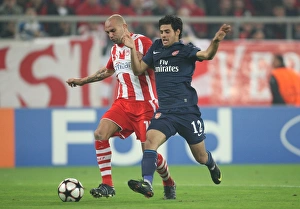 Images Dated 9th December 2009: Carlos Vela (Arsenal) Raul Bravo (Olympiacos). Olympiacos 1: 0 Arsenal, UEFA Champions League
