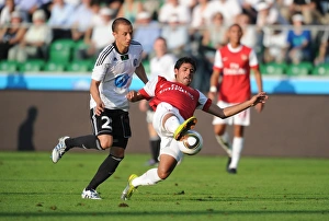 Legia Warsaw v Arsenal 2010-11 Gallery: Carlos Vela (Arsenal) Srda Knezevic (Legia). Legia Warsaw 5: 6 Arsenal, Wojska Polskiego