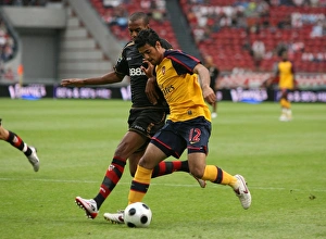 Images Dated 9th August 2008: Carlos Vela beats Seville defender Abdoulay Konko to