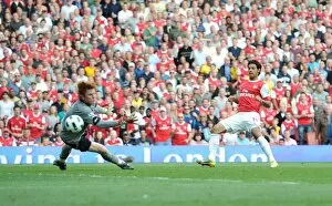 Arsenal v Bolton Wanderers 2010-11 Collection: Carlos Vela shoots past Bolton goalkeeper Adam Bogdan to score the 4th Arsenal goal