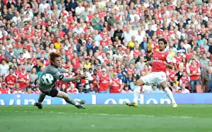 Arsenal V Bolton Wanderers 2010-11 Prints: Carlos Vela shoots past Bolton goalkeeper Adam Bogdan to score the 4th Arsenal goal