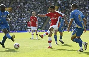 Images Dated 2nd May 2009: Carlos Vela shoots past Portsmouth goalkeeper David