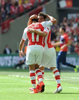 Arsenal V Manchester City - FA Community Shield 2014/15 Prints: Cazorla and Sanchez Celebrate Arsenal's First Goal Against Manchester City - FA Community Shield 2014/15