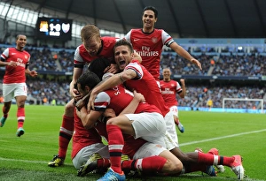 Manchester City V Arsenal 2012:13 Prints: Celebrating Glory: Giroud, Mertesacker