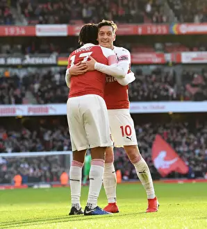 Arsenal V Burnley 2018-19 Prints: Celebrating Glory: Iwobi and Ozil's Triumphant Moment during Arsenal's Victory over Burnley