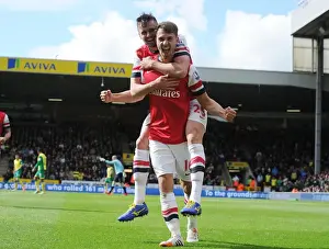 Norwich City V Arsenal 2013-14 Prints: Celebrating Glory: Ramsey and Jenkinson's Unforgettable Goal Connection (Norwich City vs)