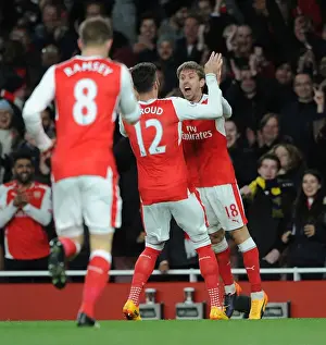 Arsenal V Leicester City 2016-17 Prints: Celebrating the Goal: Monreal and Giroud's Moment of Triumph for Arsenal against Leicester City