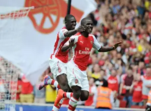 Arsenal V Benfica 2014-15 Prints: Celebrating Their Goals: Campbell and Sanogo Light Up Emirates Cup for Arsenal