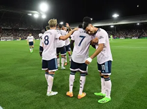 Celebrating Victory: Arsenal's Bukayo Saka, Martin Odegaard, and Gabriel Martinelli Rejoice After Scoring Against Crystal Palace (Premier League 2022-23)