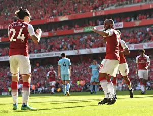 Arsenal V Burnley 2017-18 Prints: Celebrating Victory: Lacazette and Bellerin's Unforgettable Moment at Arsenal vs