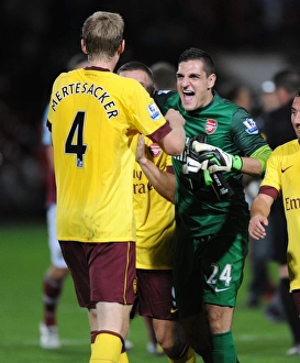 Celebrating Victory: Mannone and Mertesacker, West Ham United vs Arsenal (2012-13)