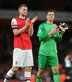 Arsenal V Liverpool 2013-14 Prints: Celebrating Victory: Per Mertesacker and Wojciech Szczesny of Arsenal