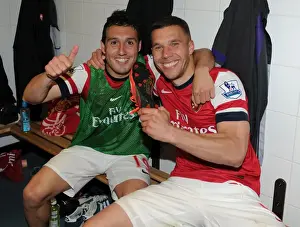 Celebrating Victory: Santi Cazorla and Lukas Podolski of Arsenal