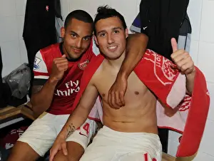 Celebrating Victory: Theo Walcott and Santi Cazorla of Arsenal