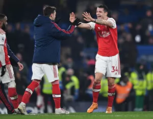Chelsea v Arsenal 2019-20 Collection: Celebrating Victory: Xhaka and Ozil Reunite in Arsenal's Chelsea Win (2019-20)