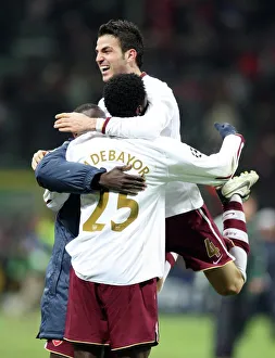 Celebration at San Siro: Fabregas, Eboue, and Adebayor Rejoice in Arsenal's 2-0 UEFA Champions League Victory over AC Milan