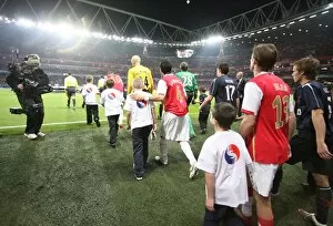 Cesc Fabregas and Alex Hleb (Arsenal) walk out before the match