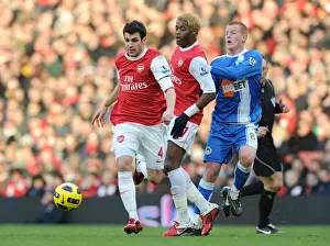 Cesc Fabregas and Alex Song (Arsenal) Ben Watson (Wigan) with mascots and officials before the match. Arsenal 3: 0 Wigan Athletic. Barclays Premier League, Emirates Stadium, Arsenal Football Club, London, 22 / 1 / 2011. Credit : Stuart MacFarlane / Arsenal